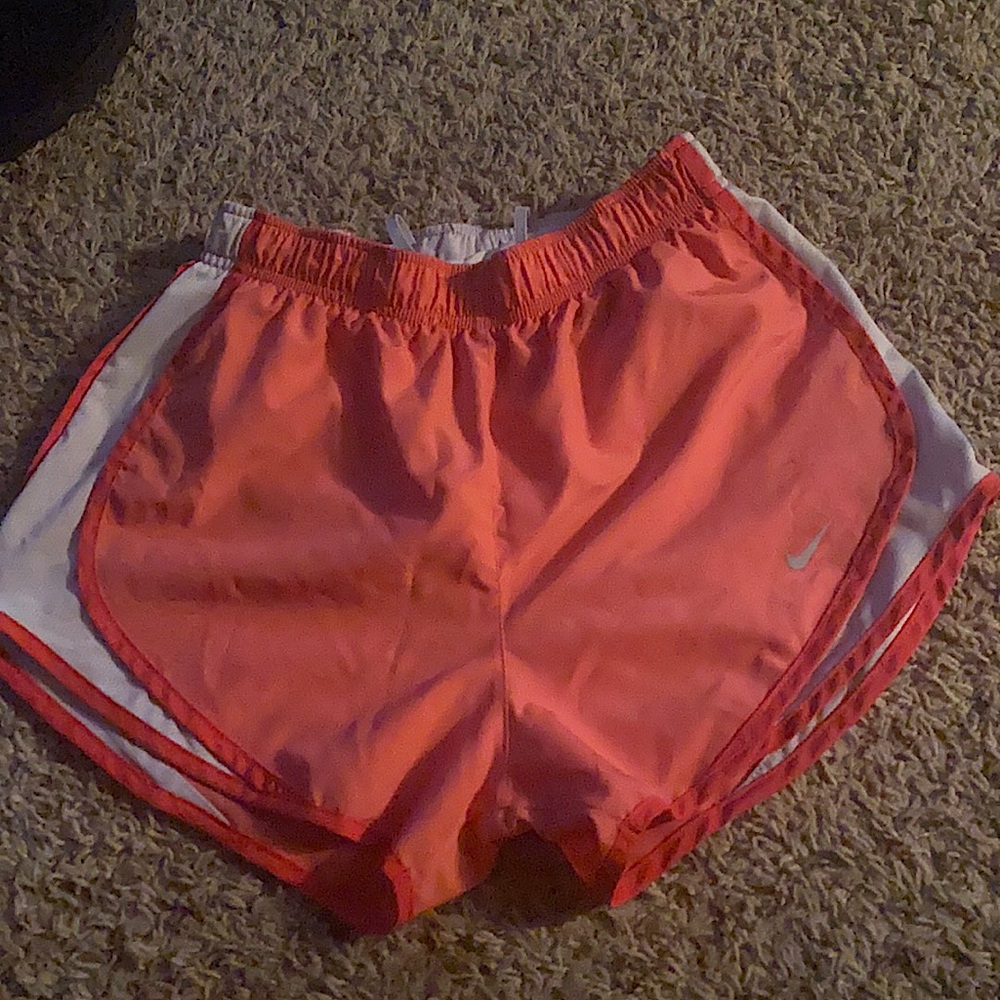 Pink and white athletic shorts with panty liner inside